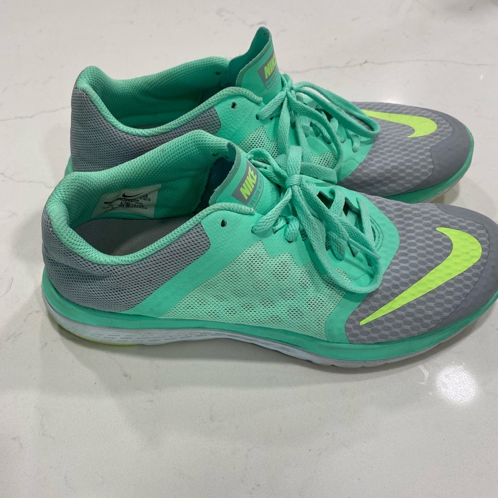 Light green and gray Nike running shoes